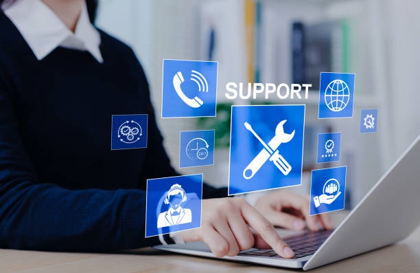 Support graphic - person on laptop with blue icons and word "support" displaying as overlay