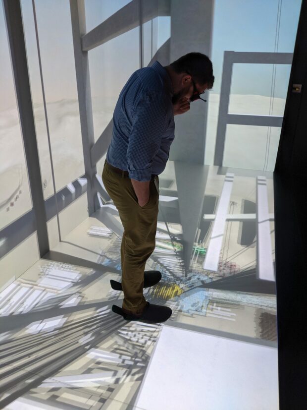 Looking down at an immersive floor in a three-wall CAVE system