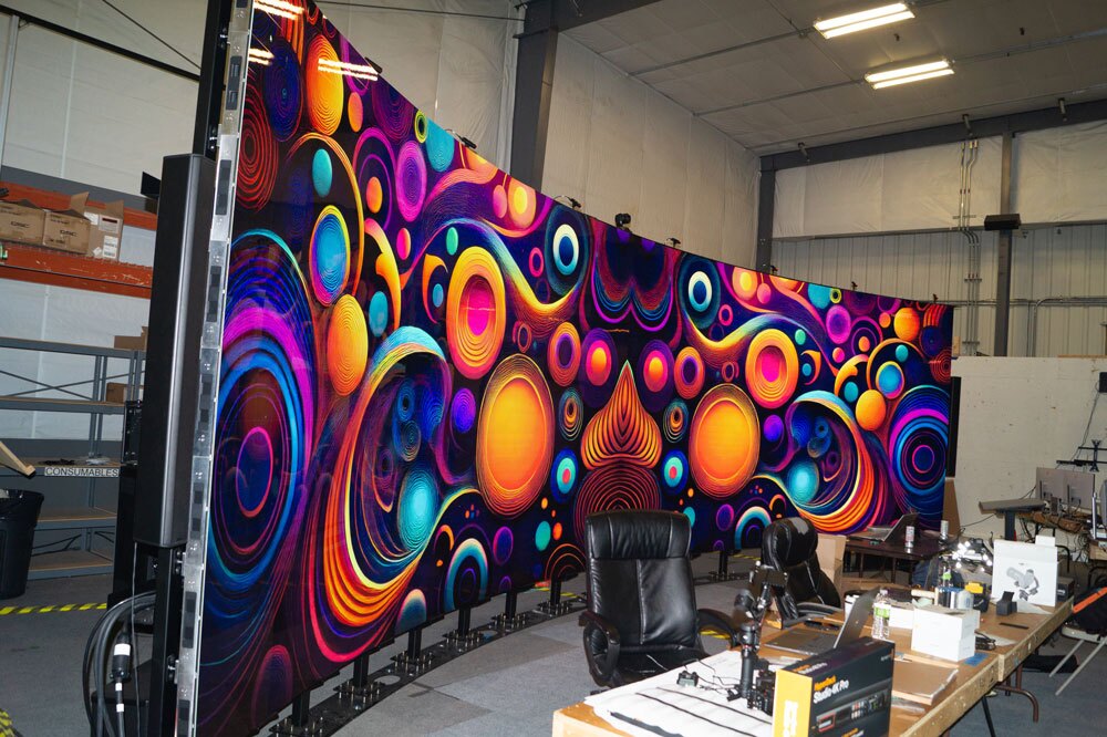 Large curved LED screen with abstract graphic