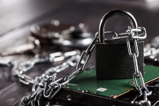 Metal padlock and chain locking up a computer hard drive