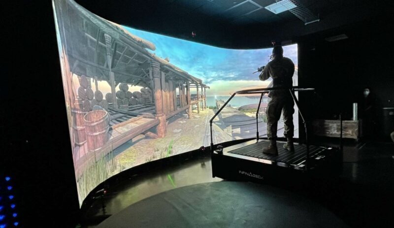 Curved screen LED in front of an omni-directional treadmill for army personnel training