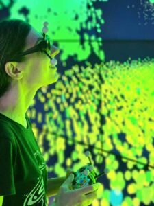Woman wearing HMD goggles and using Carnegie Data Visualization Tools