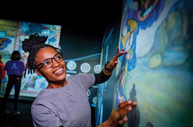 Young girl with glasses using Interactive LED Display