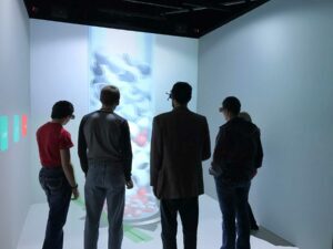 4 people standing in immersive space