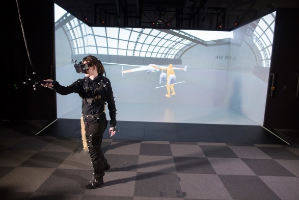 Wowan wearing head mounted display in Mechdyne CAVE